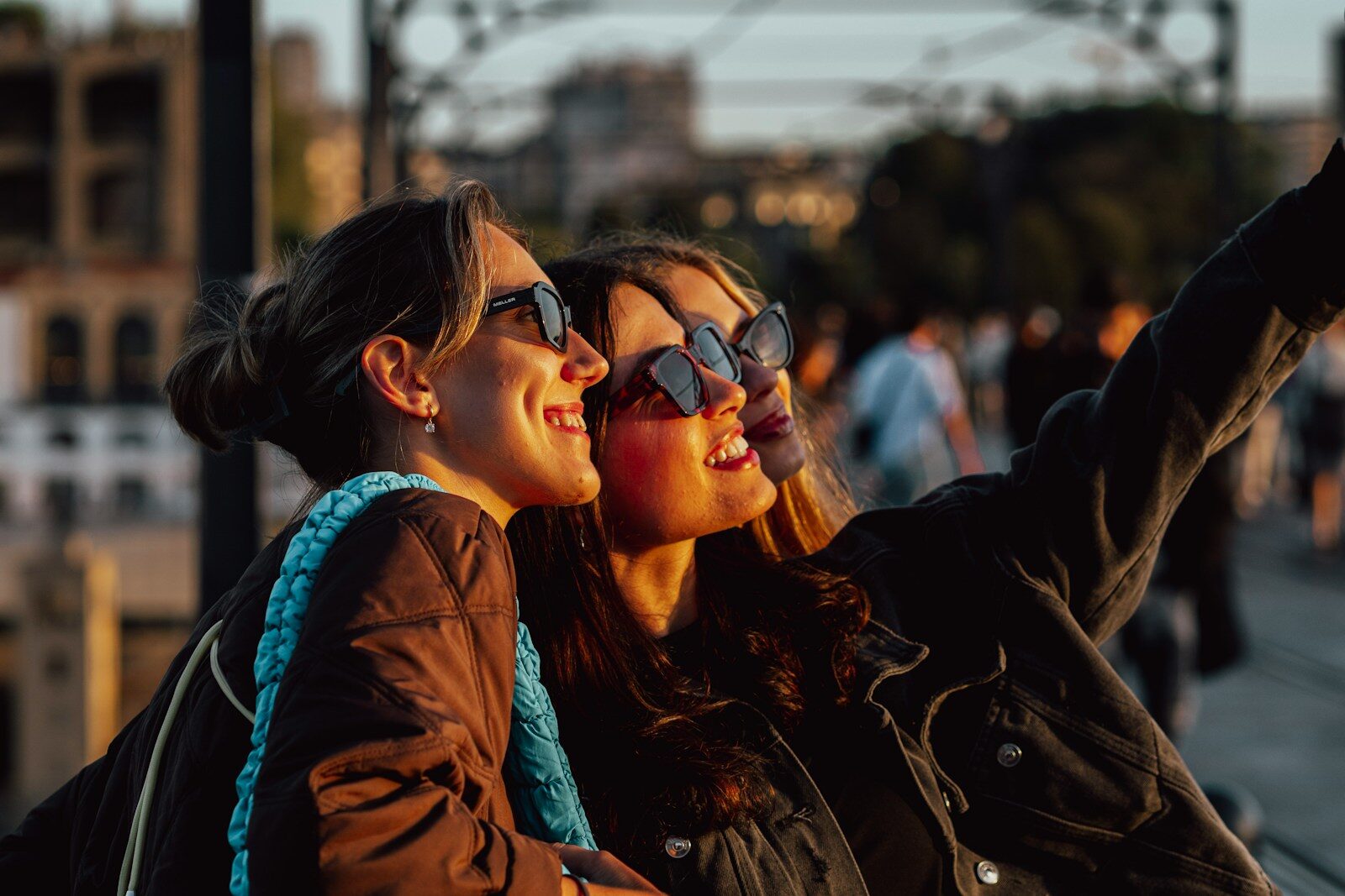 Two smiling women taking a selfie outdoors